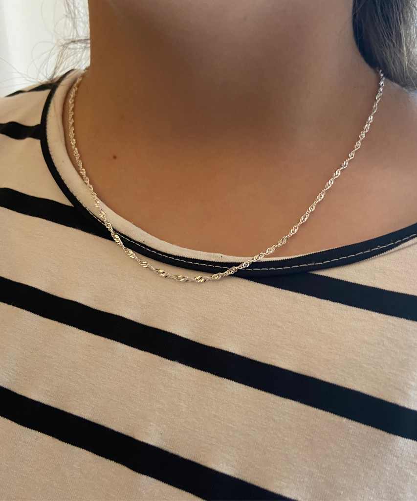 Woman Wearing a Singapore Chain Necklace in Sterling Silver
