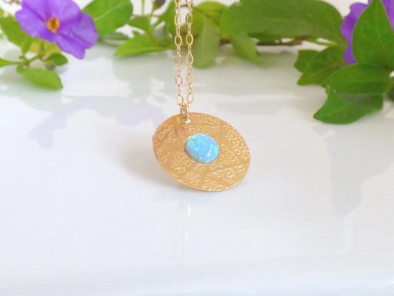 Gold fill disc pendant with a blue opal stone.