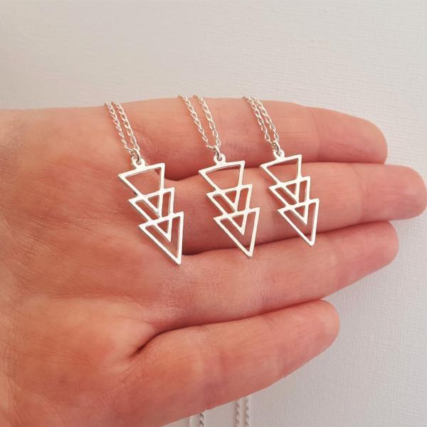 The picture shows 3 delicate Sterling Silver necklaces with a geometric triangle shaped pendant-AlinMay