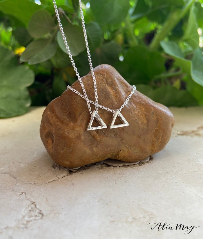 tiny Sterling silver smooth/hammered triangle that sliding freely along a delicate Sterling silver links chain.